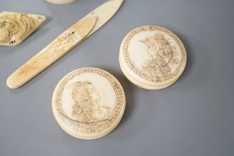 A pair of 19th century ivory balm pots, 3.75cm., a smallDieppe triptych figure, 6.5cm. a Meiji tiger brooch and a Dutch page marker.